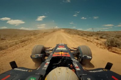 Daniel Ricciardo drives a Red Bull F1 car on an Australia road trip