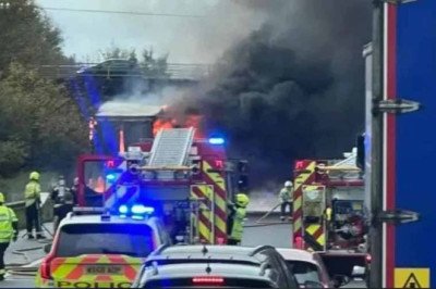 Half-term getaways are plunged into chaos as M5 closes: Drivers stuck in five hour queue resort to playing football to pass the time after huge lorry blaze