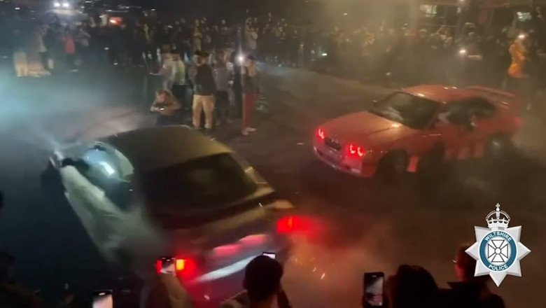 Shocking moment driver loses control while doing 'doughnuts' at car meet and ploughs into parked vehicle as crowds watch on
