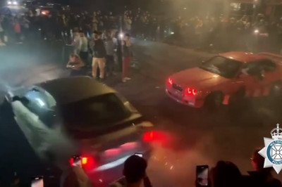 Shocking moment driver loses control while doing 'doughnuts' at car meet and ploughs into parked vehicle as crowds watch on