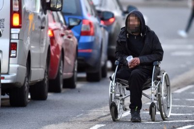 The professional gangs running Britain's Beggar Junctions: How 'aggressive' groups 'work in shifts' to hassle drivers out of hundreds every day