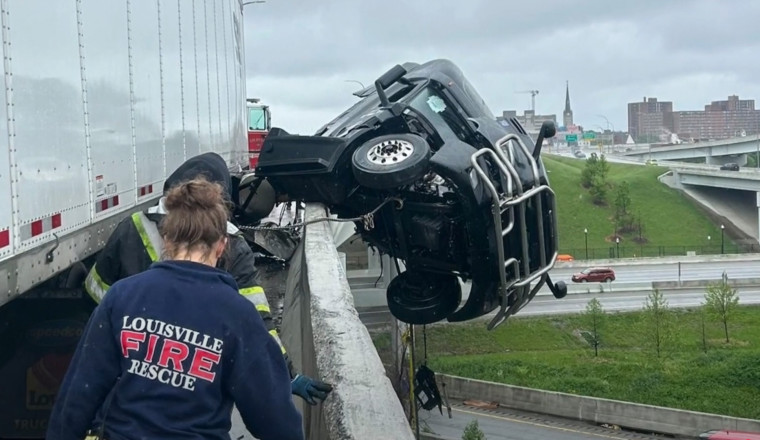Incredibly Quick Crane Rescue Saves Semi-Truck Driver Dangling off Bridge