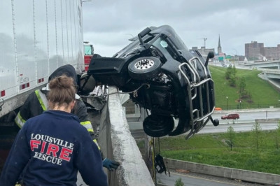 Incredibly Quick Crane Rescue Saves Semi-Truck Driver Dangling off Bridge