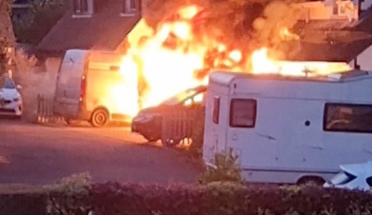 Electric car bursts into flames on homeowners' driveway and engulfs £550,000 family home in terrifying suburban inferno