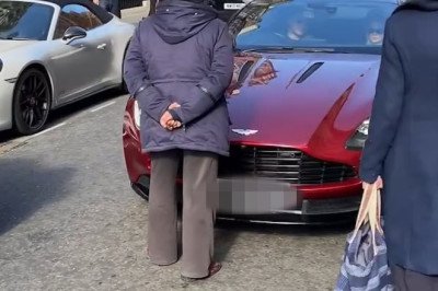 Moment furious woman walks into middle of the road in Mayfair to confront Aston Martin driver for revving too loudly