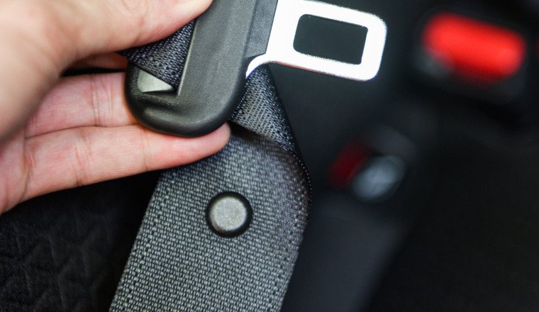 What Is That Little Button On Your Car's Seat Belt For?