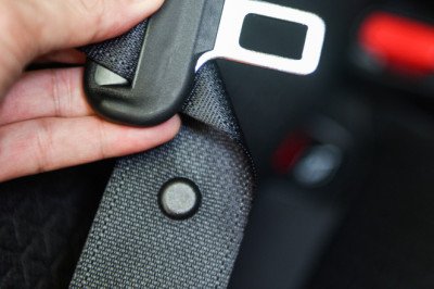 What Is That Little Button On Your Car's Seat Belt For?