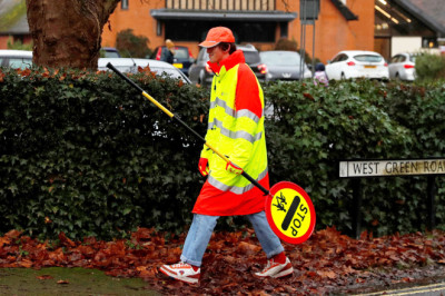 Families rally against cuts to lollipop crossings