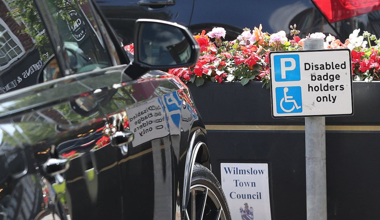 Wayne Rooney almost falls foul of Cheshire traffic wardens after leaving his Audi 4x4 in a disabled parking zone - as ex footballer 'prepares for £400,000 a year Match Of The Day role'