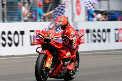 Marquez survives penalty scare to win bizarre Brno sprint