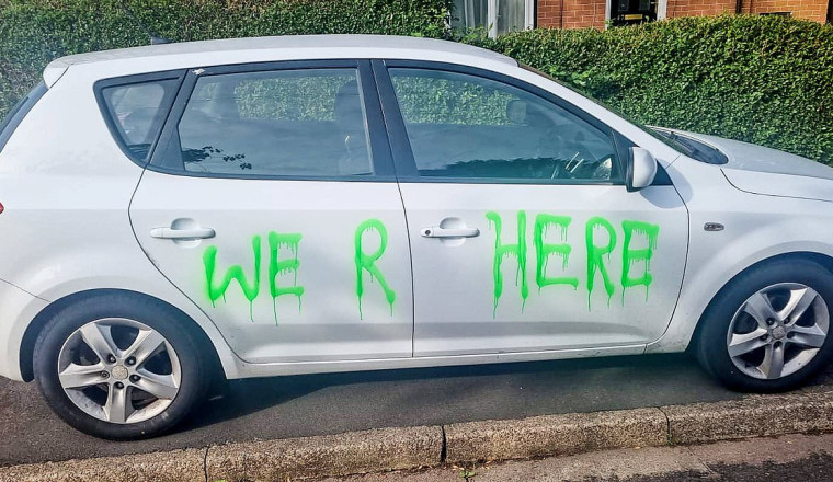 Vandals wreck 41 cars in one night as they smash windows and spray paint bizarre messages on vehicles