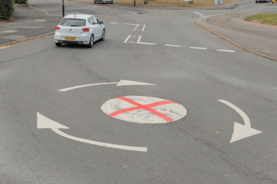 Painted St George's Cross on mini-roundabouts sparks debate among residents