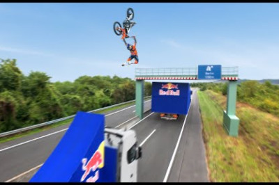 World First! Motorbike Flip Between Two Moving Trucks