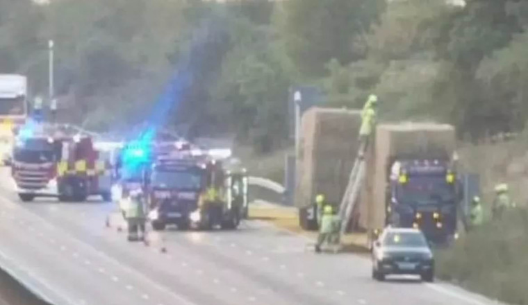 Travel chaos as M25 stretch SHUTS after 'multi-vehicle crash' sparks fire as drivers try to return to work after Bank Holiday