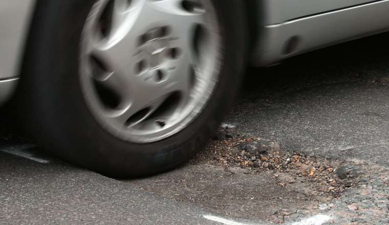 Pothole-related breakdowns jumped 9% between April and June - here's how to claim for compensation if your car is damaged by a crater