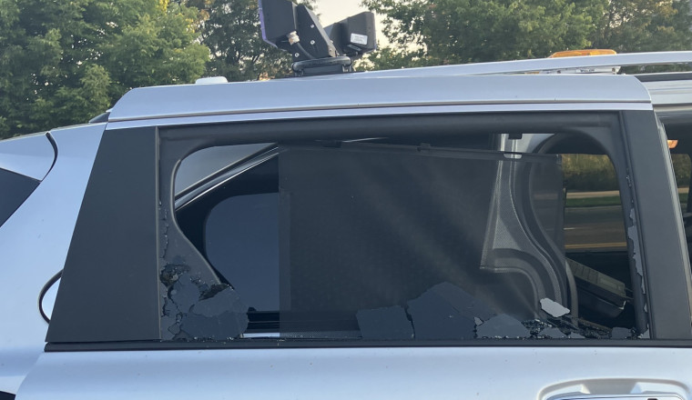 Man Attacks Police Photo Enforcement Van, Gets Caught On Camera