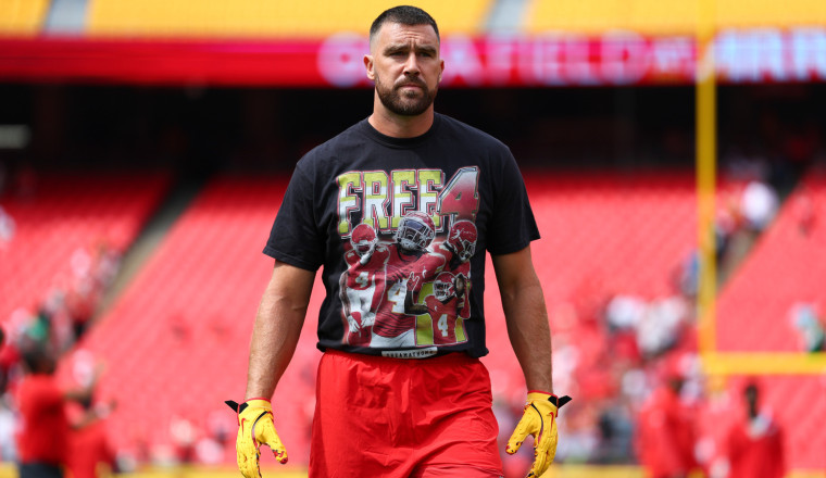 Travis Kelce Wears Tasteless Shirt Defending Teammate Who Crashed Lamborghini Urus Into Multiple Vehicles And Fled The Scene