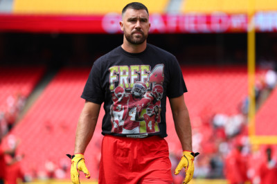 Travis Kelce Wears Tasteless Shirt Defending Teammate Who Crashed Lamborghini Urus Into Multiple Vehicles And Fled The Scene