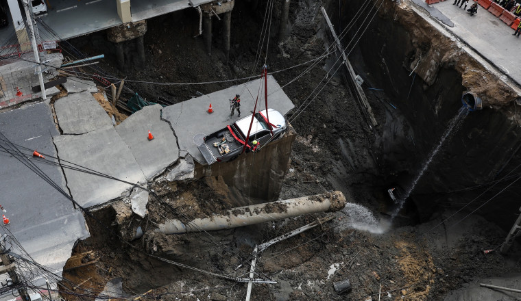 Watch an Entire Street Just Vanish Into a Giant Sinkhole
