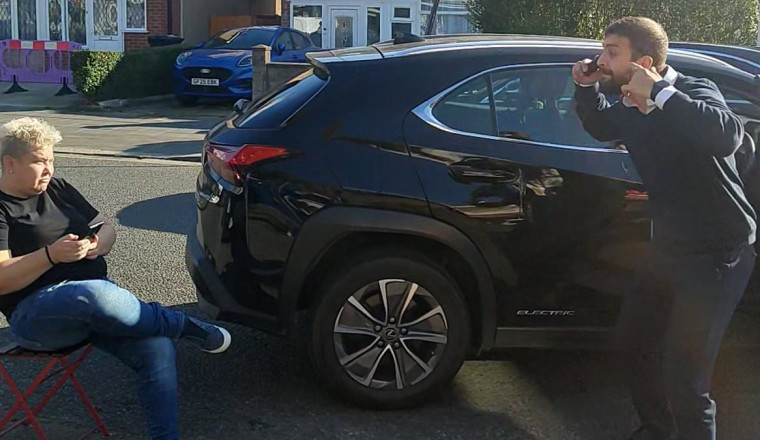 Furious roadside row erupts over woman blocking driver from parking his car so she can 'reserve spot for a friend'