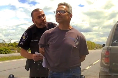 Driver Arrested For Laughing At Cop After Flashing His Lights