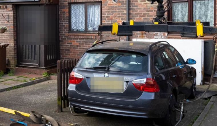 'We'll be knocking on your door': Sadiq Khan's Ulez enforcers lift driver's BMW off driveway as they issue warning to motorists who dodge fines