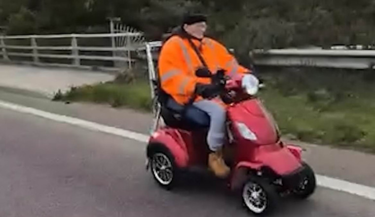 Mobility scooter rider stuns fellow motorists by cruising along busy dual carriageway without a care in the world