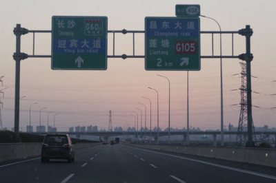 Here's what driving in China is really like - from anti-drowsiness lasers on motorways to temple toll booths