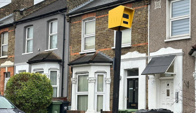 Frustrated residents put up fake speed camera to deal with speeding drivers on their road - only for council workers to remove it as it starts working