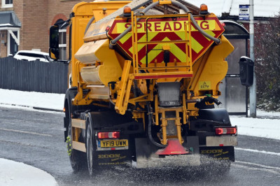 Go out and grit your own roads, taxpayers told: Homeowners given salt, hi-vis jackets, and gloves by councils after tax hike