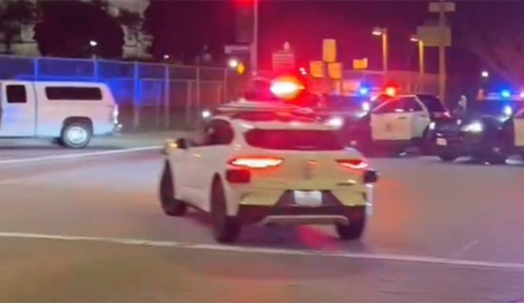 Robotaxi Rolls Through LAPD Crime Scene As Suspect Is Held At Gunpoint