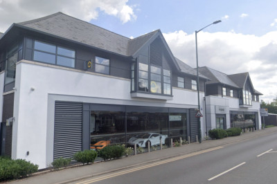 Man arrested after pick-up crashes through window of McLaren dealership
