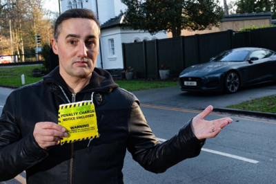 Furious homeowner vows to fight council after being fined for parking outside his house