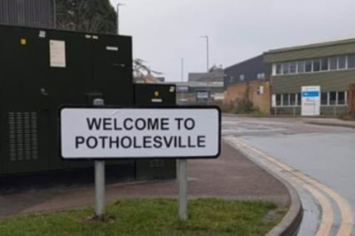 Road is so full of craters that residents rename it Potholesville... yet 'no authority will fix it'