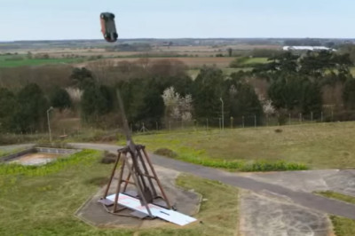If You're Having A Hard Day, Just Watch These Cars Get Trebucheted
