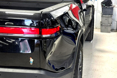 Rivian’s One-Piece Bedside Turned A Dinner-Plate Dent Into Used Corolla Money