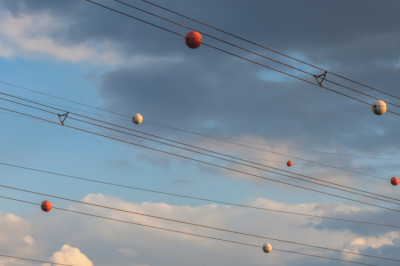 The Reason Power Lines Have Orange Balls Is Almost As Interesting As How They Get There