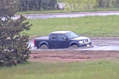 Pickup Truck Driver Moves 'Road Closed' Sign, Immediately Gets Stuck In Wet Concrete
